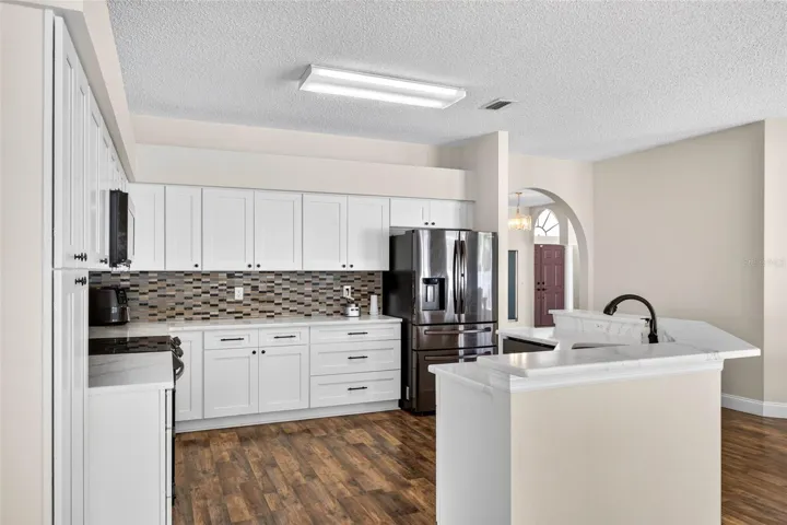 UPDATED kitchen with Quartz countertops and stainless appliances