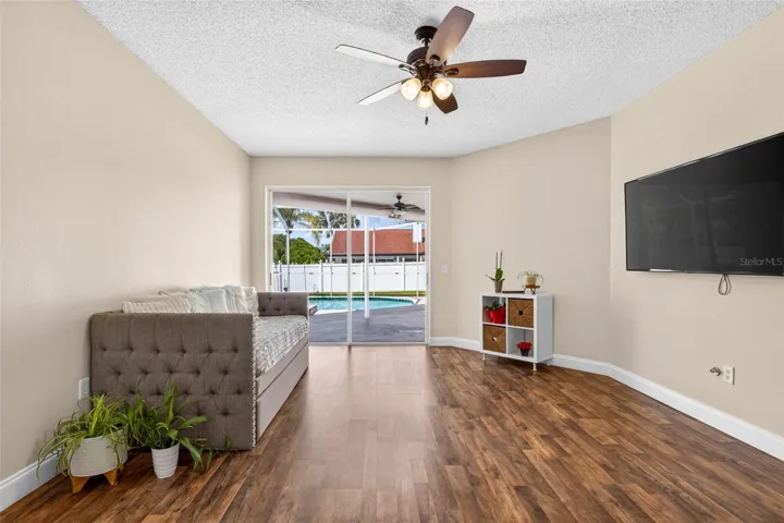 Formal living space and view to screened pool lanai