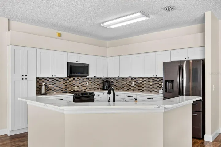 UPDATED kitchen with Quartz countertops and stainless appliances