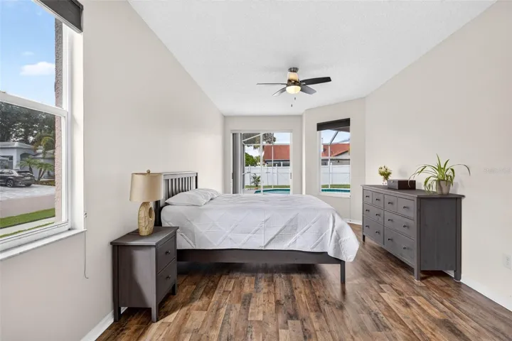 Large primary bedroom with access to pool