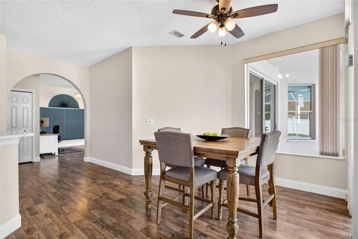 Eat in space in kitchen with a view of the screened pool lanai