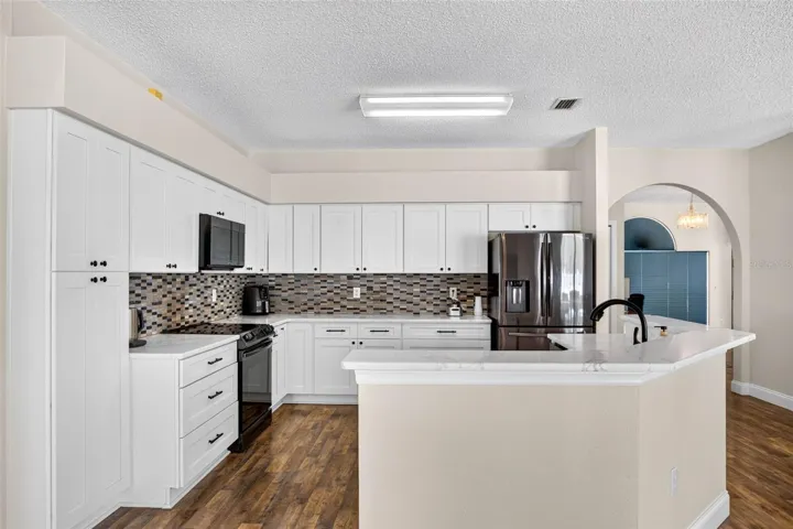 UPDATED kitchen with Quartz countertops and stainless appliances