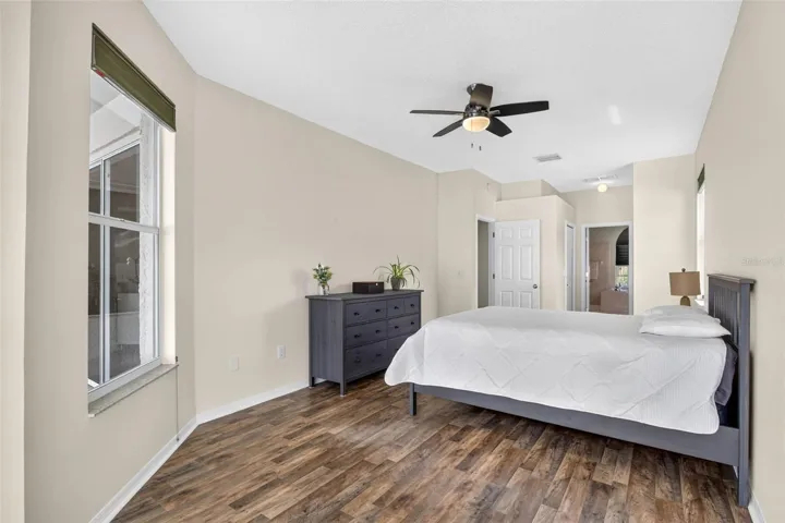 Large primary bedroom with access to pool