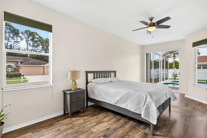 Large primary bedroom with access to pool