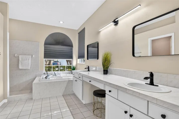 Large primary bath with shower and separate garden tub