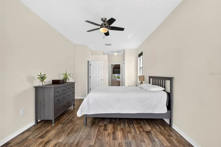 Large primary bedroom with access to pool
