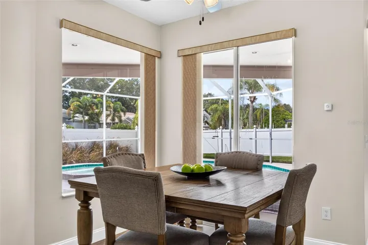 Eat in space in kitchen with a view of the screened pool lanai
