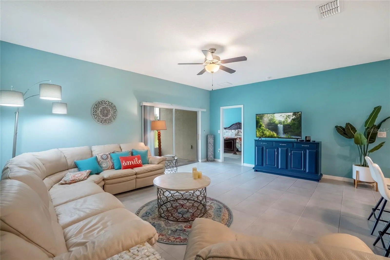Great Room. Patio Doors lead to screened porch