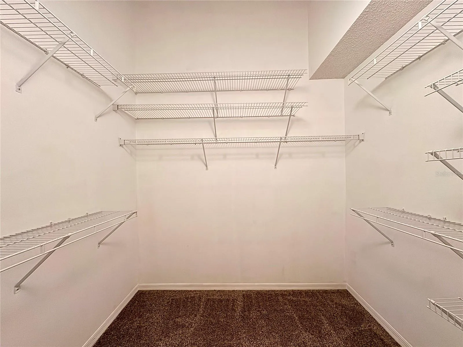 Primary Bedroom walk in closet