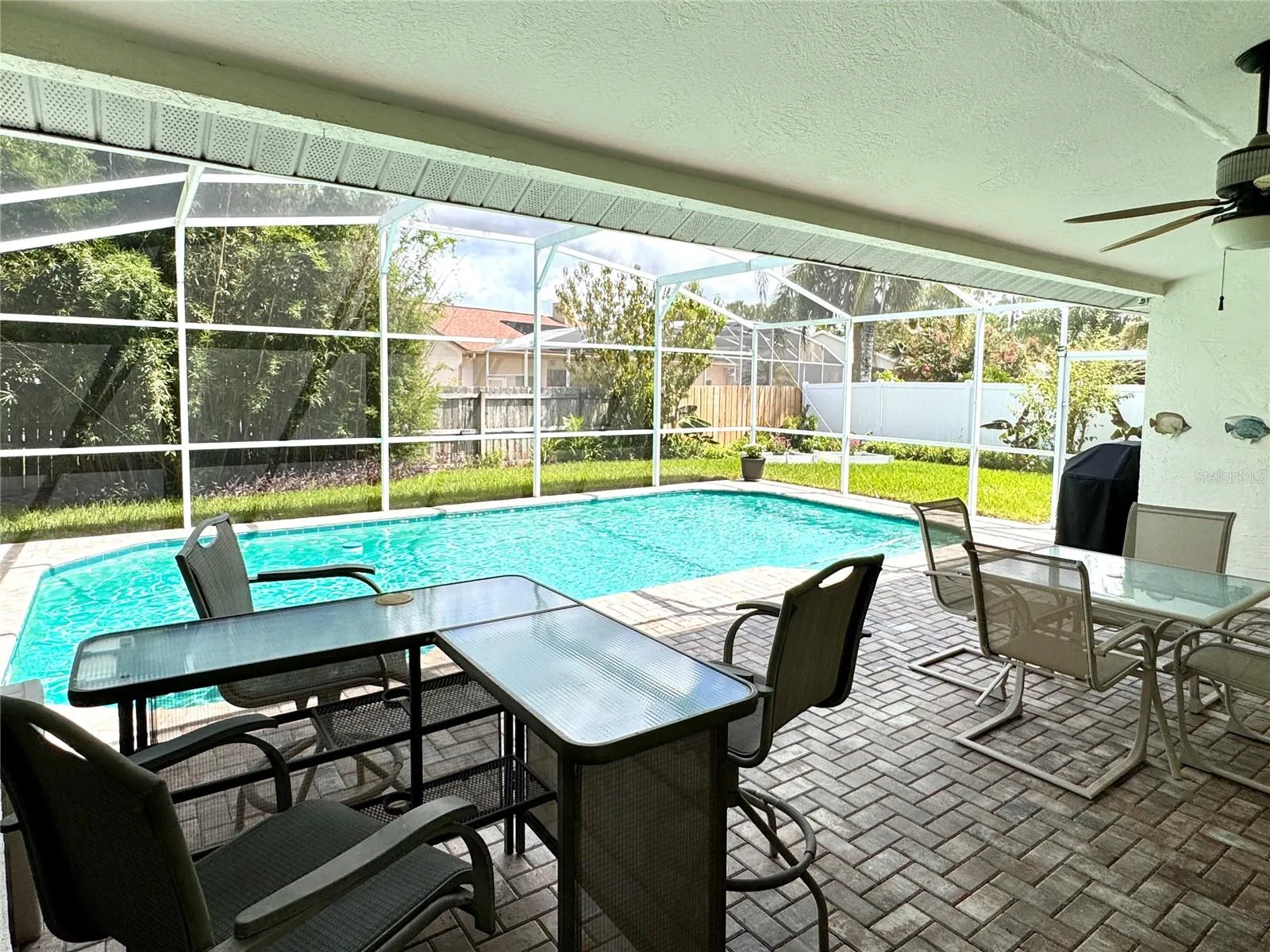 Screened-in pool with covered outdoor living area