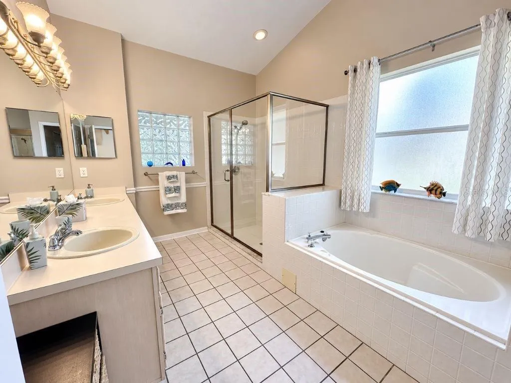 Primary bath with dual vanities, soaking tub and separate shower