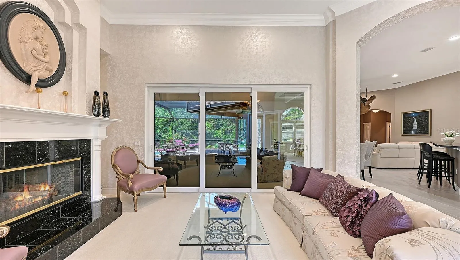 Separate Living Room with decorative natural gas fireplace.
