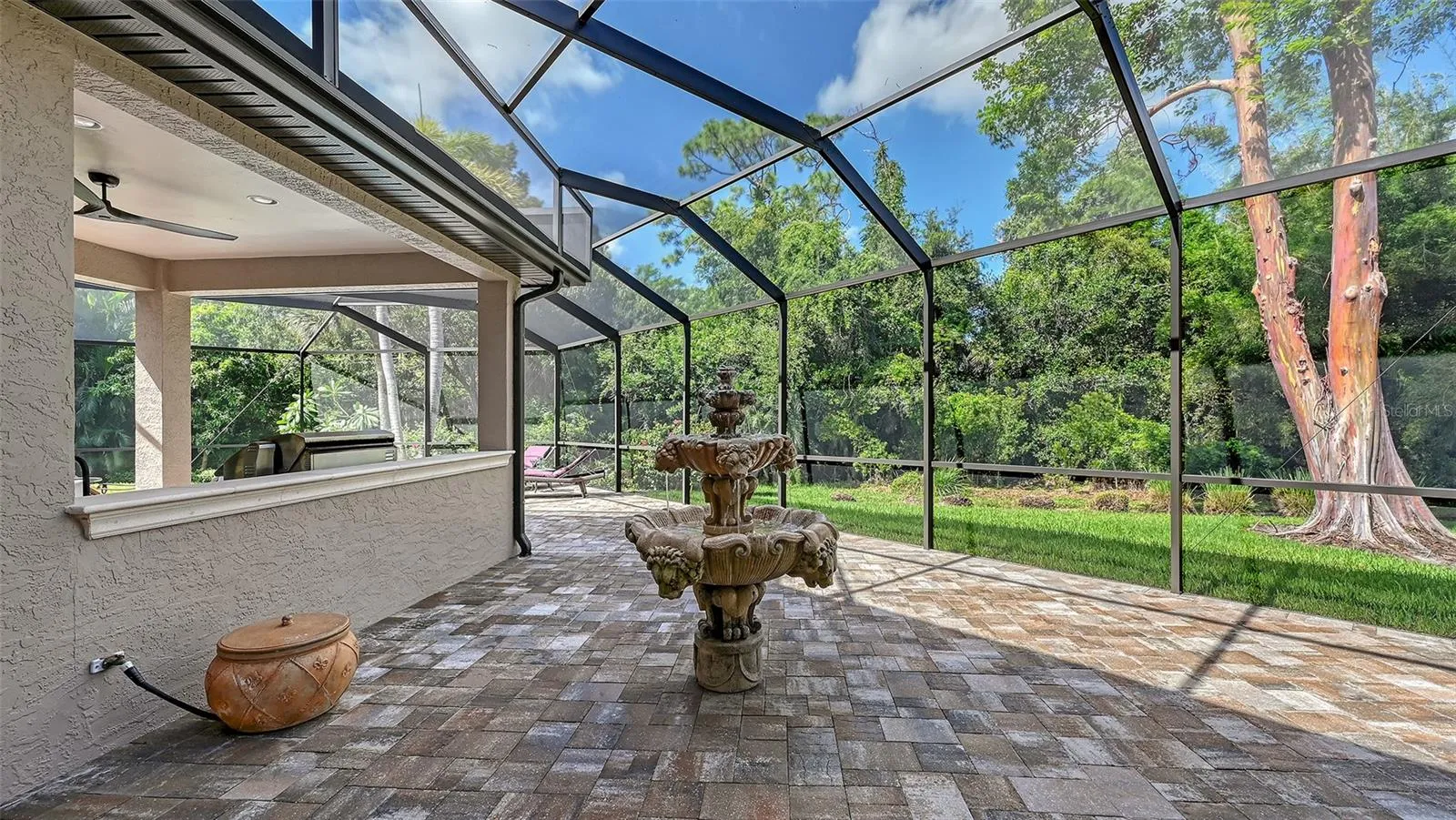 Side screen pool area with fountain.