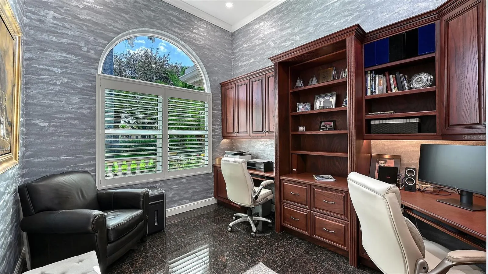 Private Executive office with built-ins off living area.