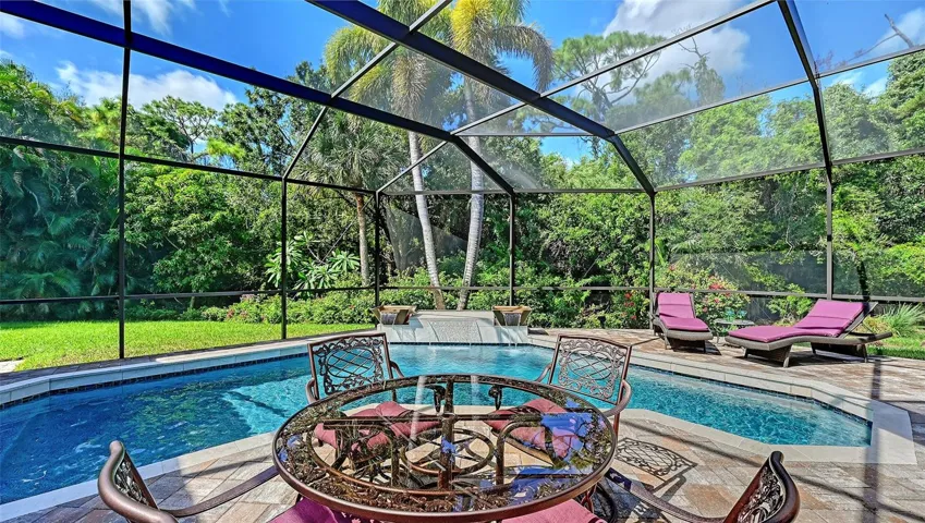 Screened pool area with waterfall.