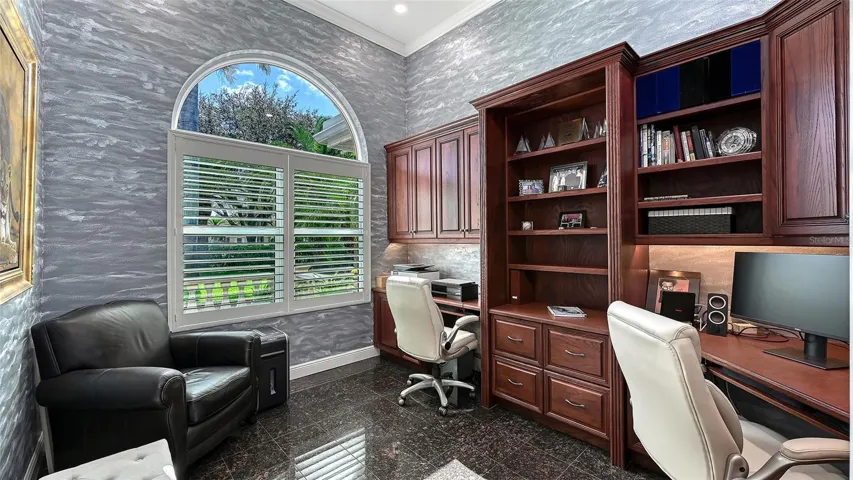 Private Executive office with built-ins off living area.