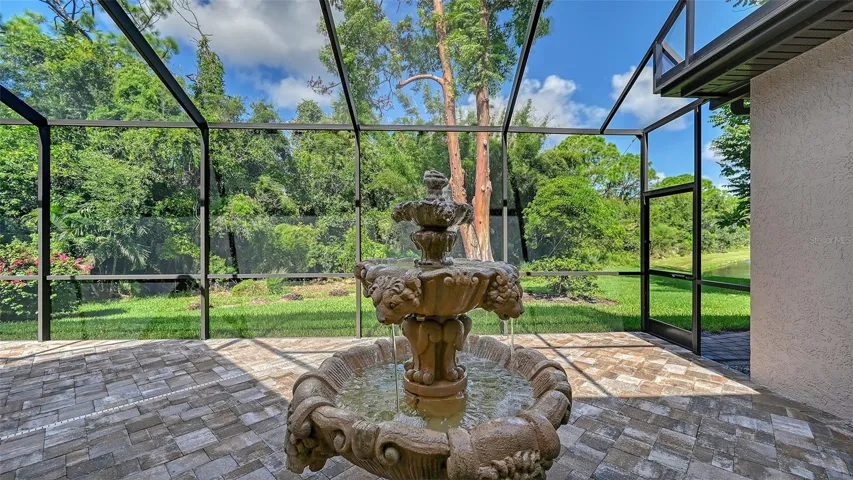 Side screen pool area with fountain.