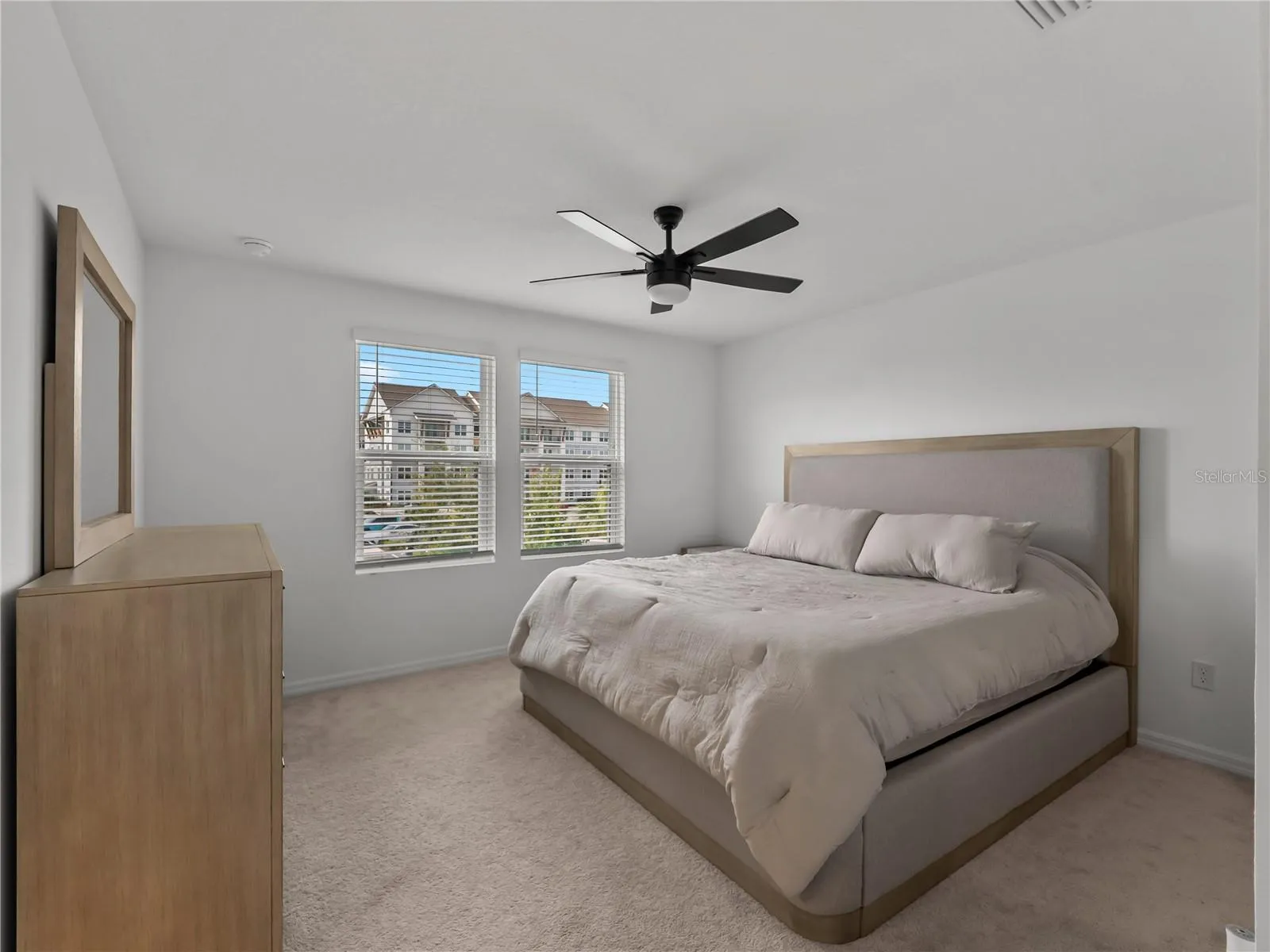 Spacious primary bedroom with walk-in closet and ensuite bathroom