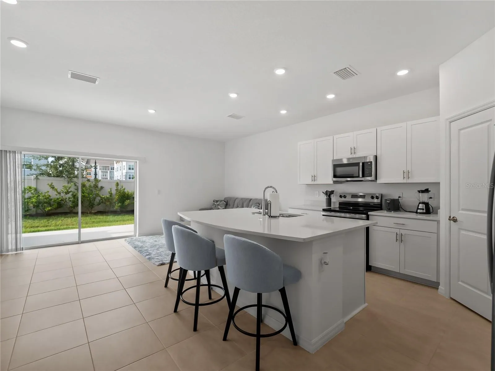 Natural light flows in the kitchen and family room on the first floor.