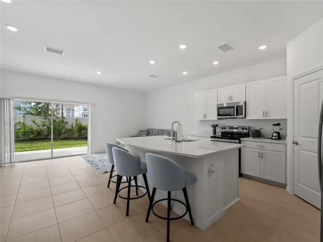Natural light flows in the kitchen and family room on the first floor.