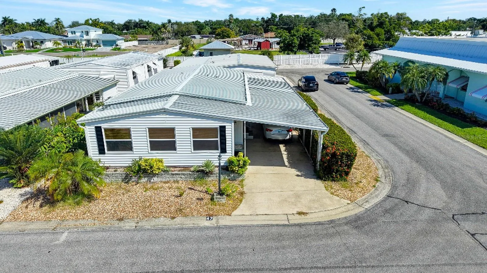 Great Shot showing corner lot and clubhouse on the right side