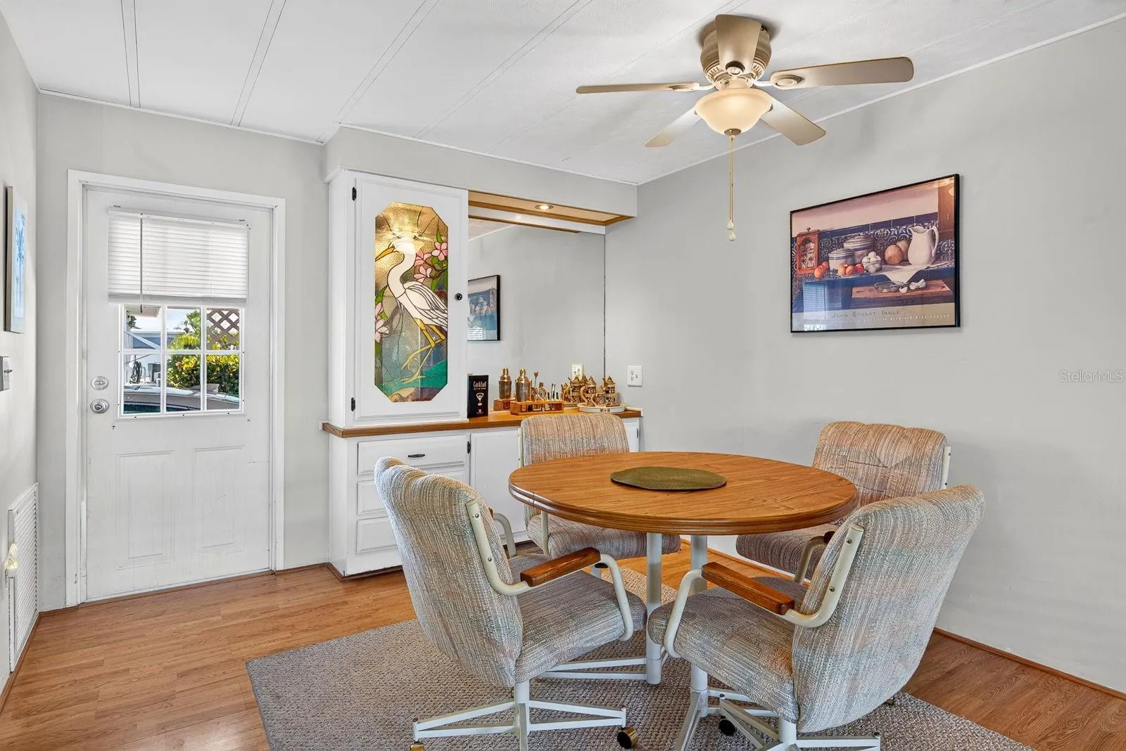 Dining area with Built in cabinet, also door to carport area