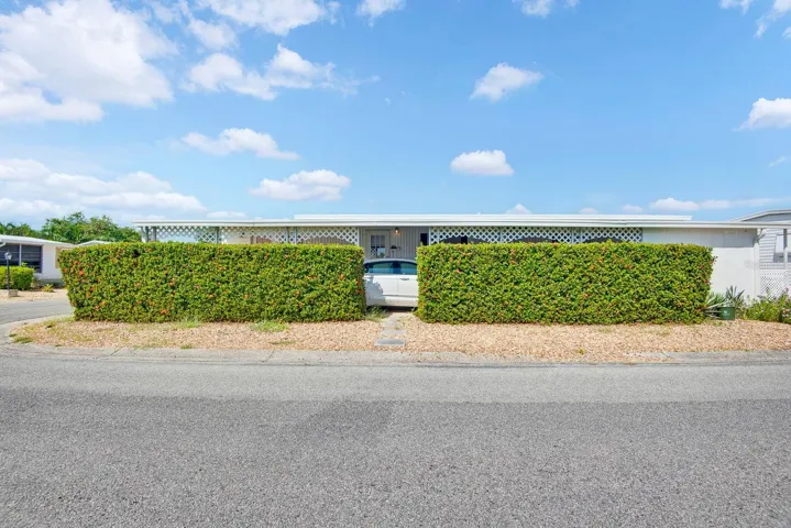 Side View from Clubhouse facing the home, large corner lot