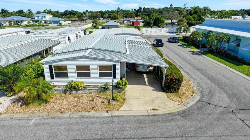 Great Shot showing corner lot and clubhouse on the right side