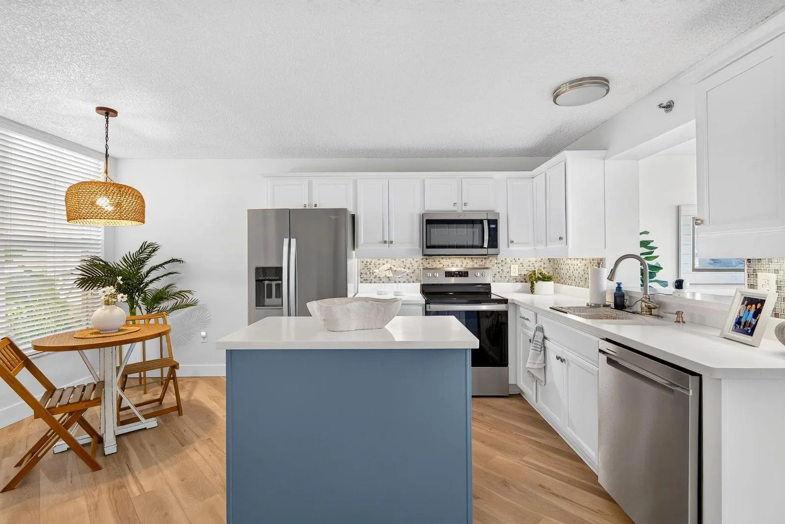Large Kitchen featuring island and breakfast table to the side