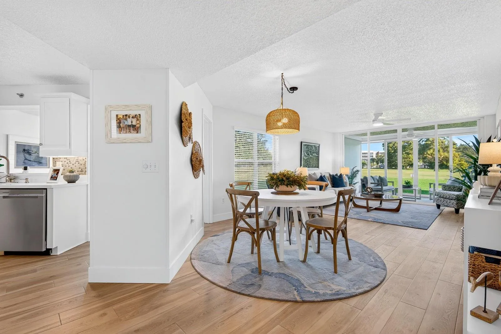 Nice view of kitchen to the left, dining on the right and Living Room area with lanai