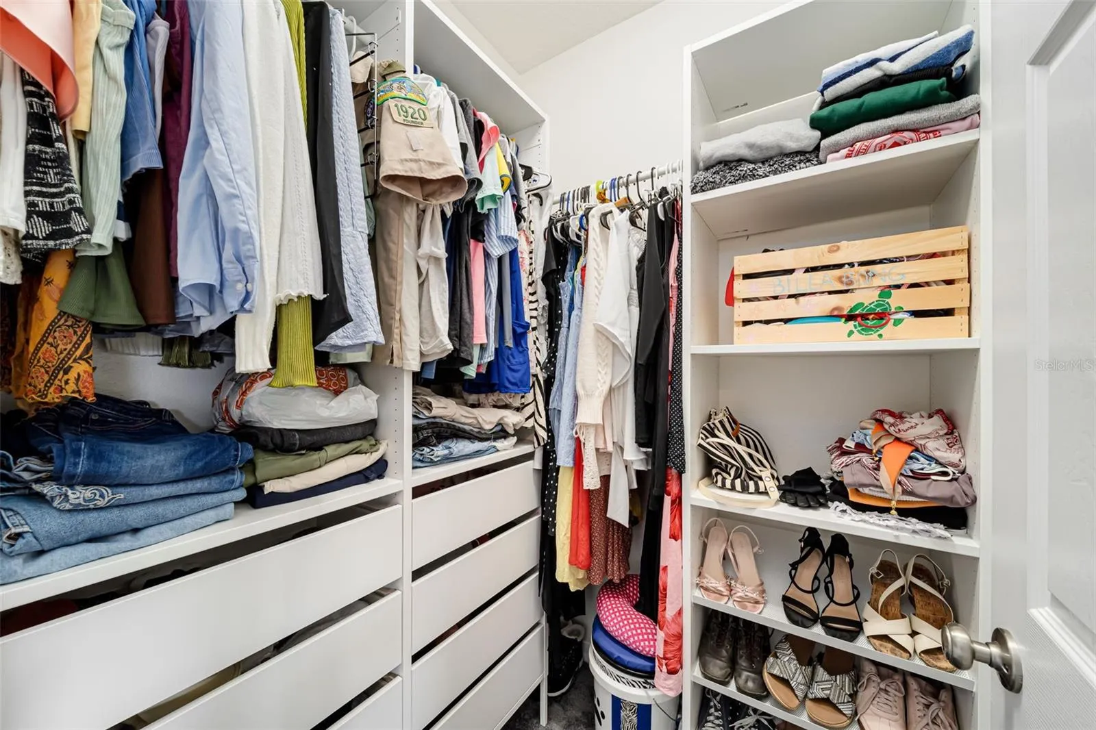 Large walk-in closet with plenty of storage.