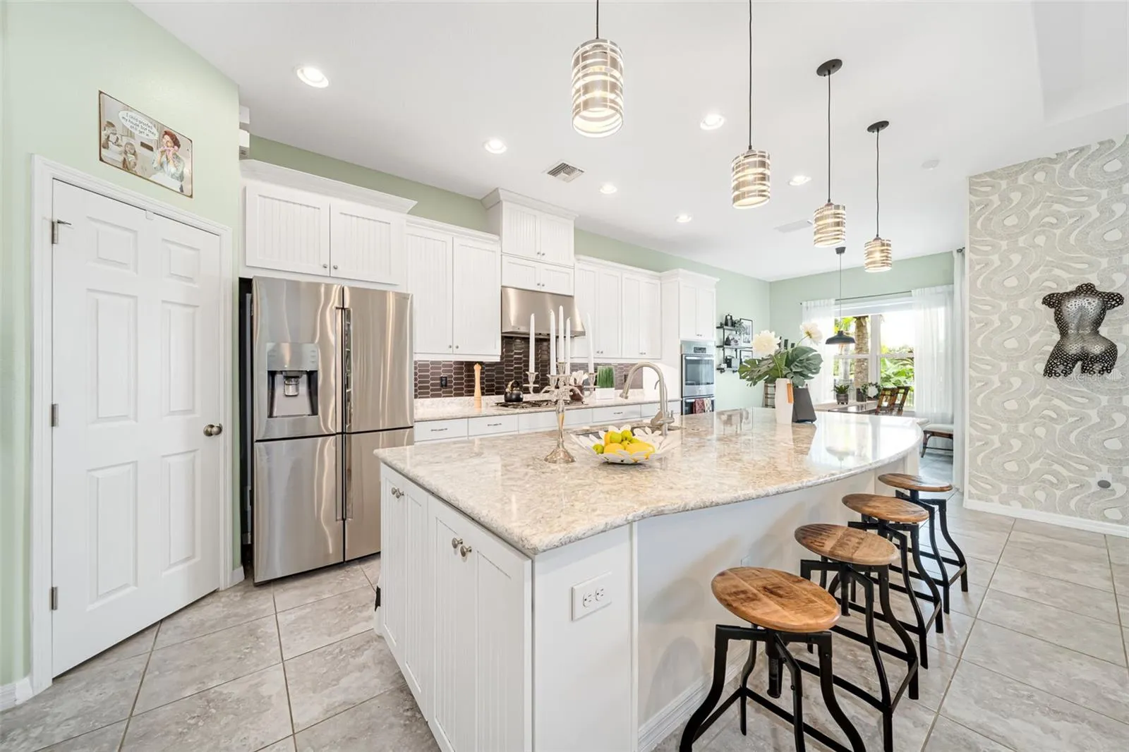 A chef-inspired kitchen with a gas range and custom finishes ideal for cooking and entertaining.