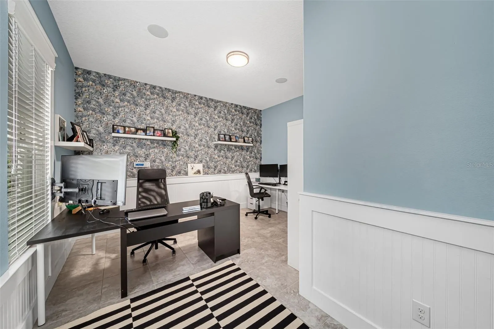 Multi-functional space ideal for a home office, study, or bonus room.