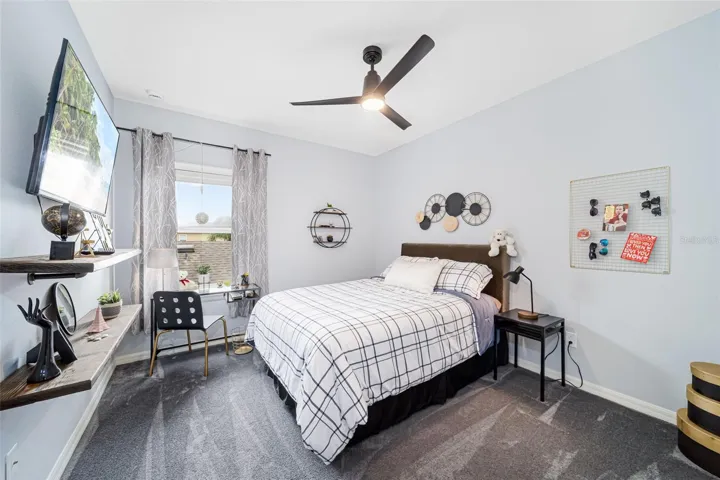 Comfortable third bedroom with built-in closet storage.