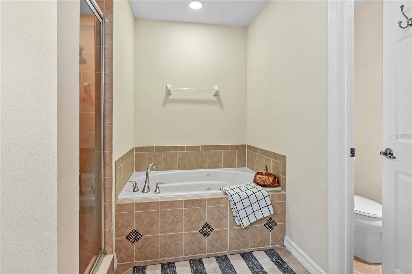 relaxing jetted soaking tub and private wc