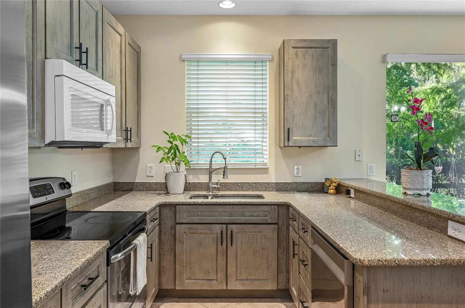 new kitchen with soft close cabinets and stone counters