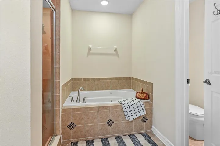 relaxing jetted soaking tub and private wc