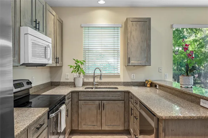 new kitchen with soft close cabinets and stone counters
