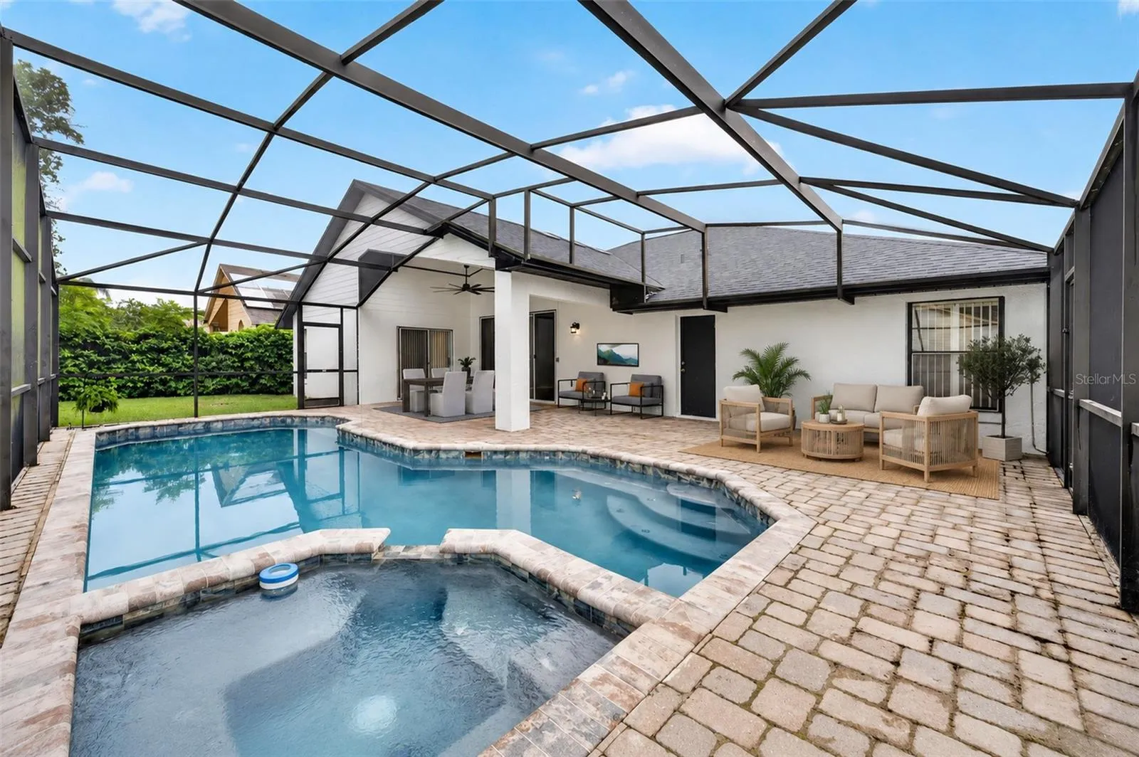 Resurfaced enclosed pool with staged patio