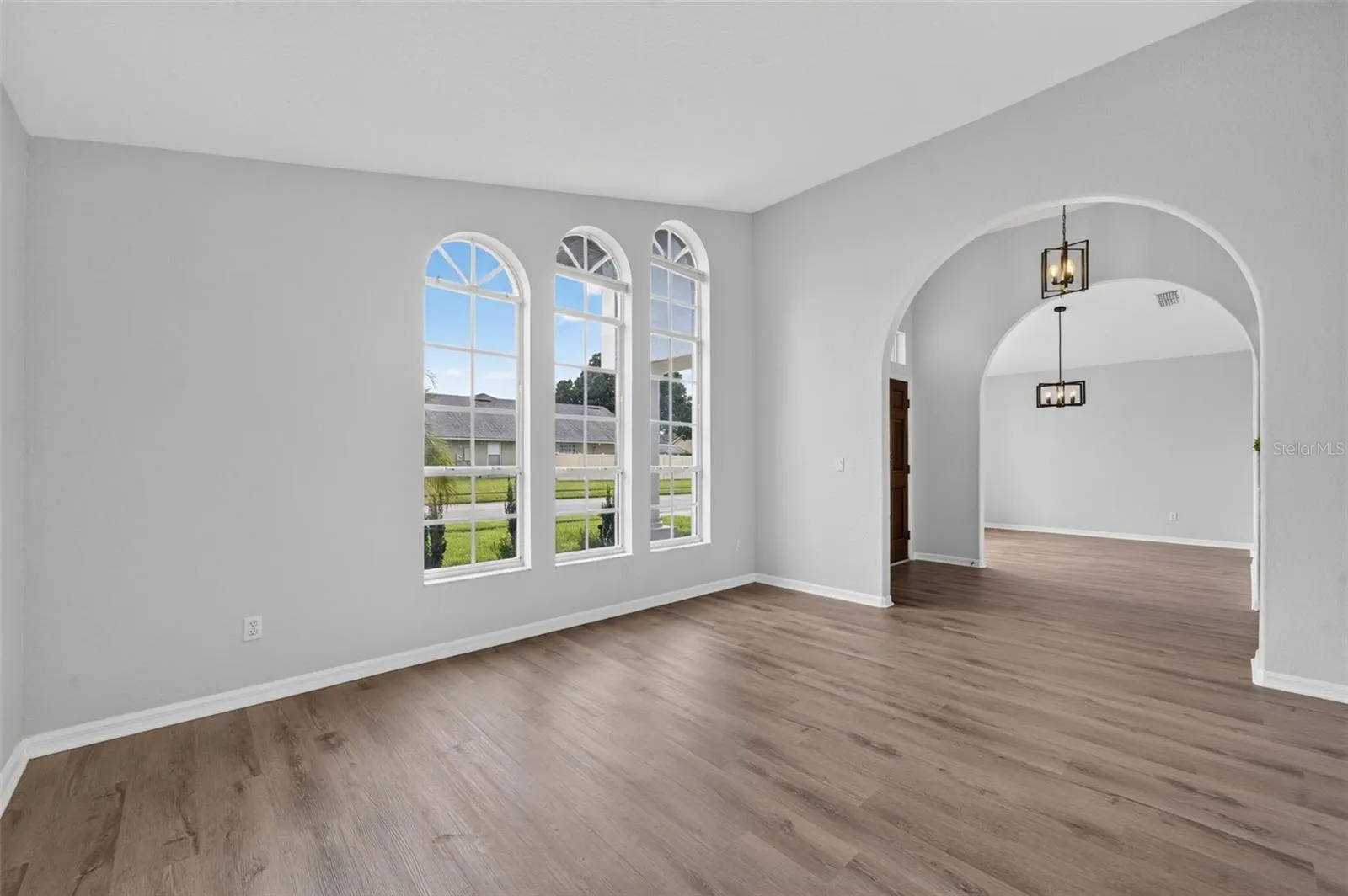 Vacant living room, dining room and foyer
