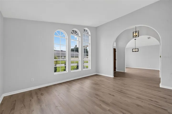Vacant living room, dining room and foyer