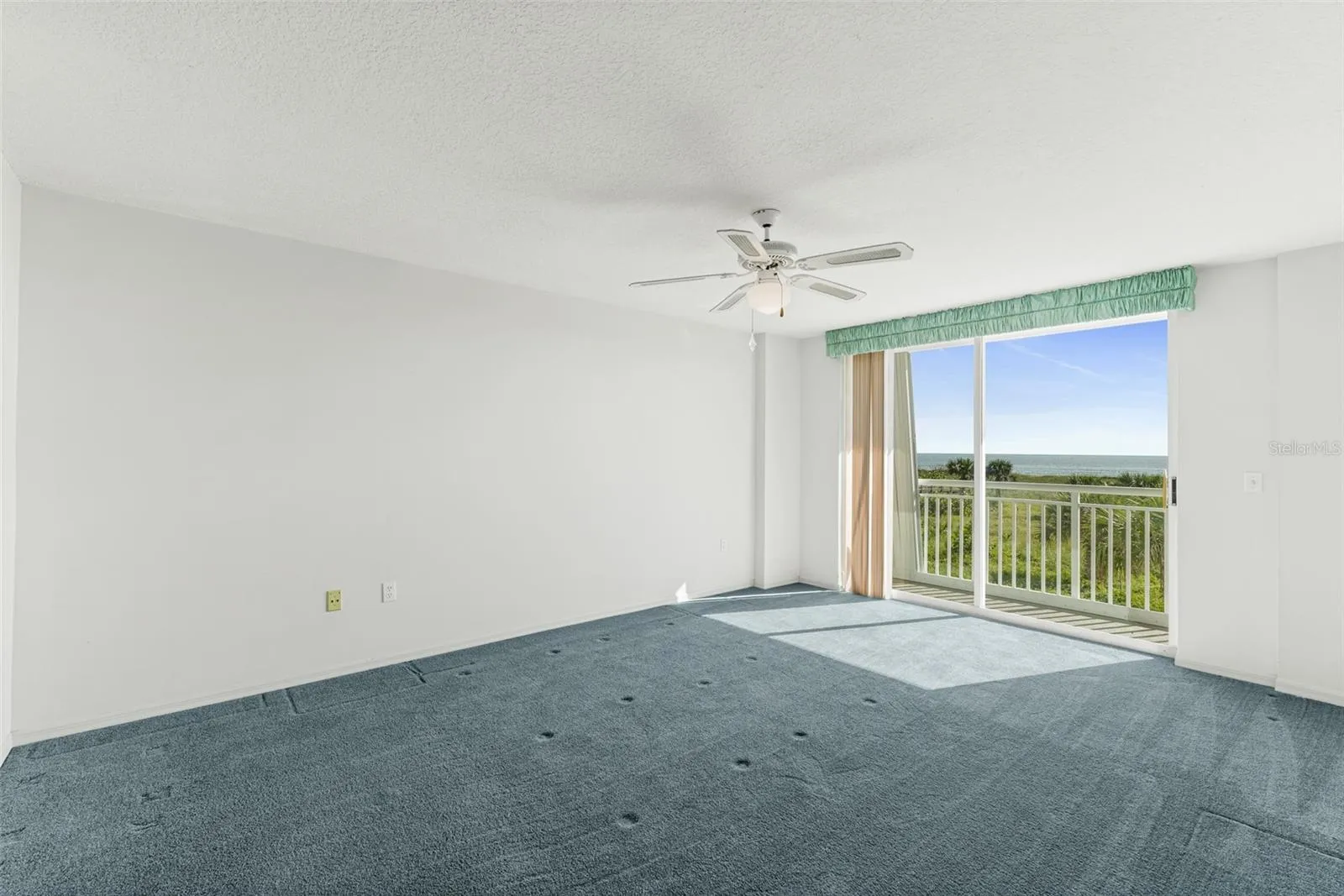 Primary Bedroom with Ocean Views &amp; Balcony Patio Access