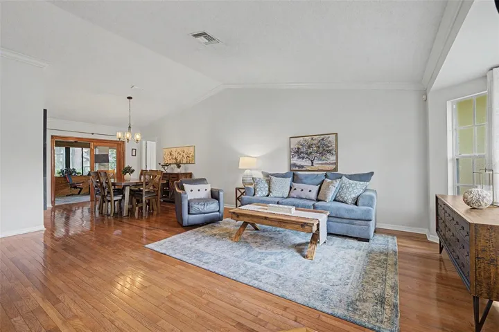 Vaulted ceiling and view of Florida room