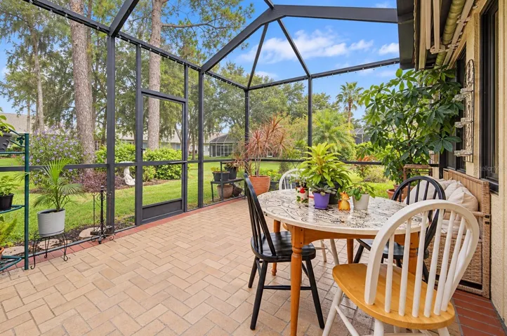 Screened in brick lanai is a great place to start or end your day