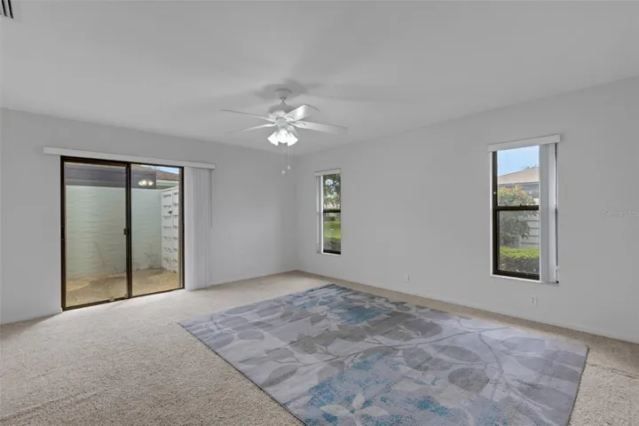 Primary Bedroom - Sliders to Courtyard Lanai