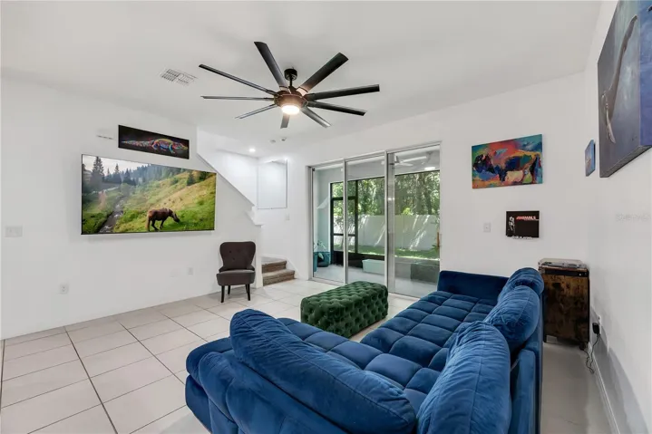 The staircase to the second floor is conveniently tucked away at the rear of the home.