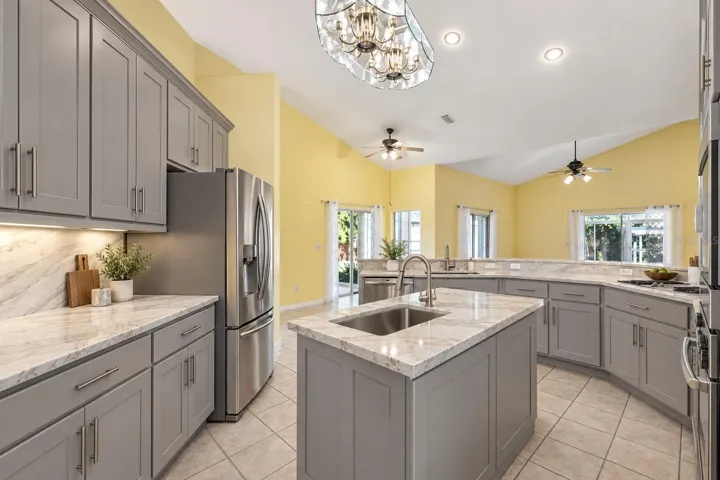 Virtually Changed to show remodel with new counters and painted existing cabinets.