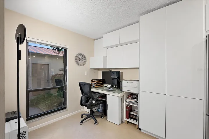 Office area smoothly integrated into the kitchen.