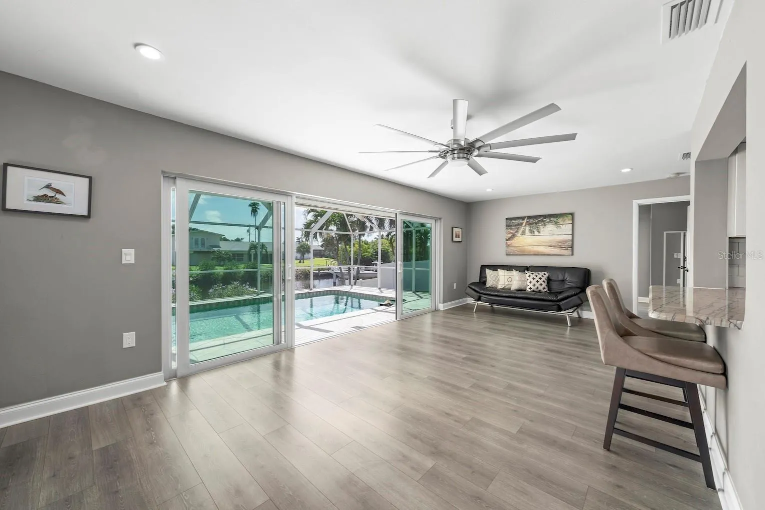 Impact sliders (shown open) leading to the lanai / pool area.