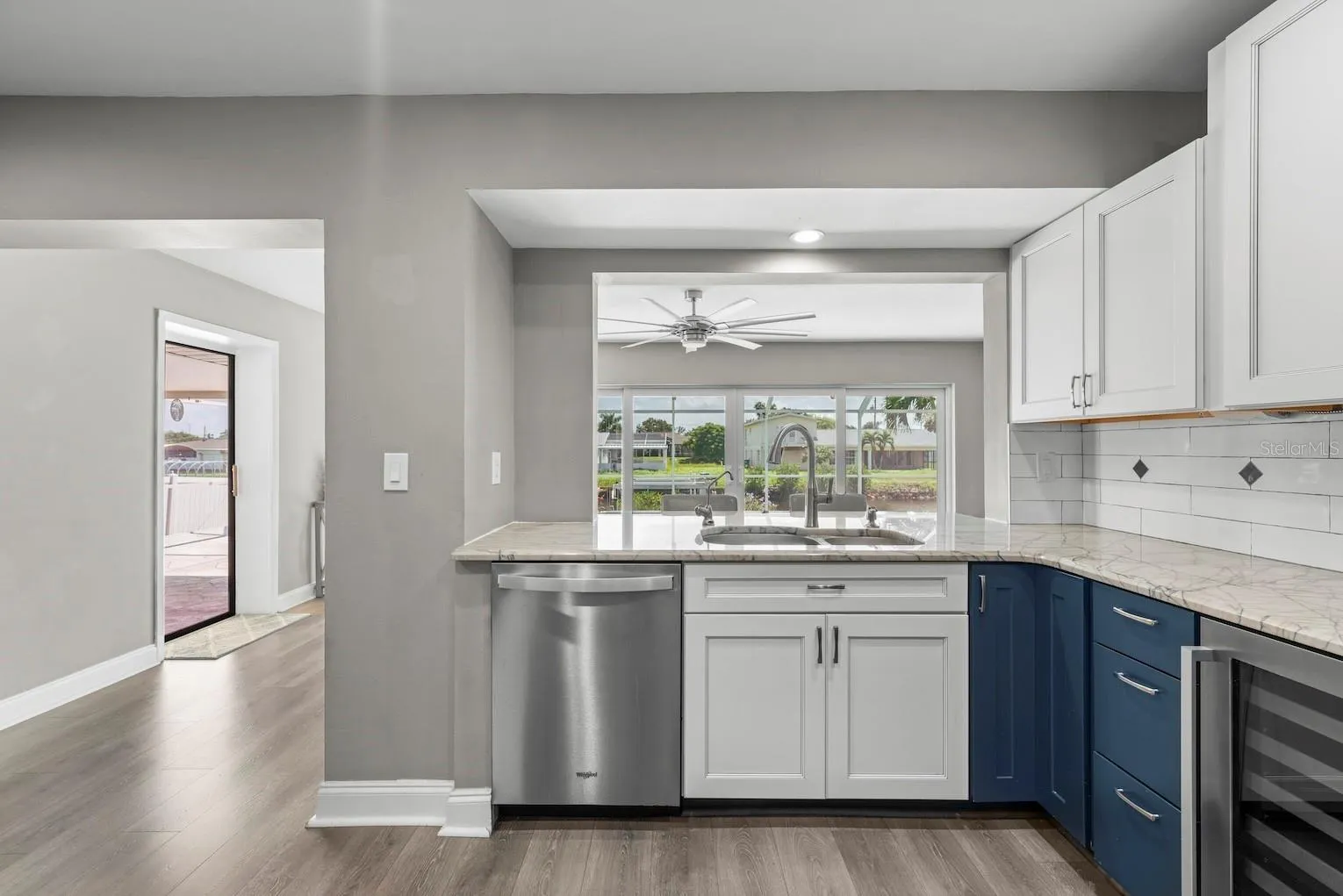 Showing pass through view to pool, lanai, and canal!